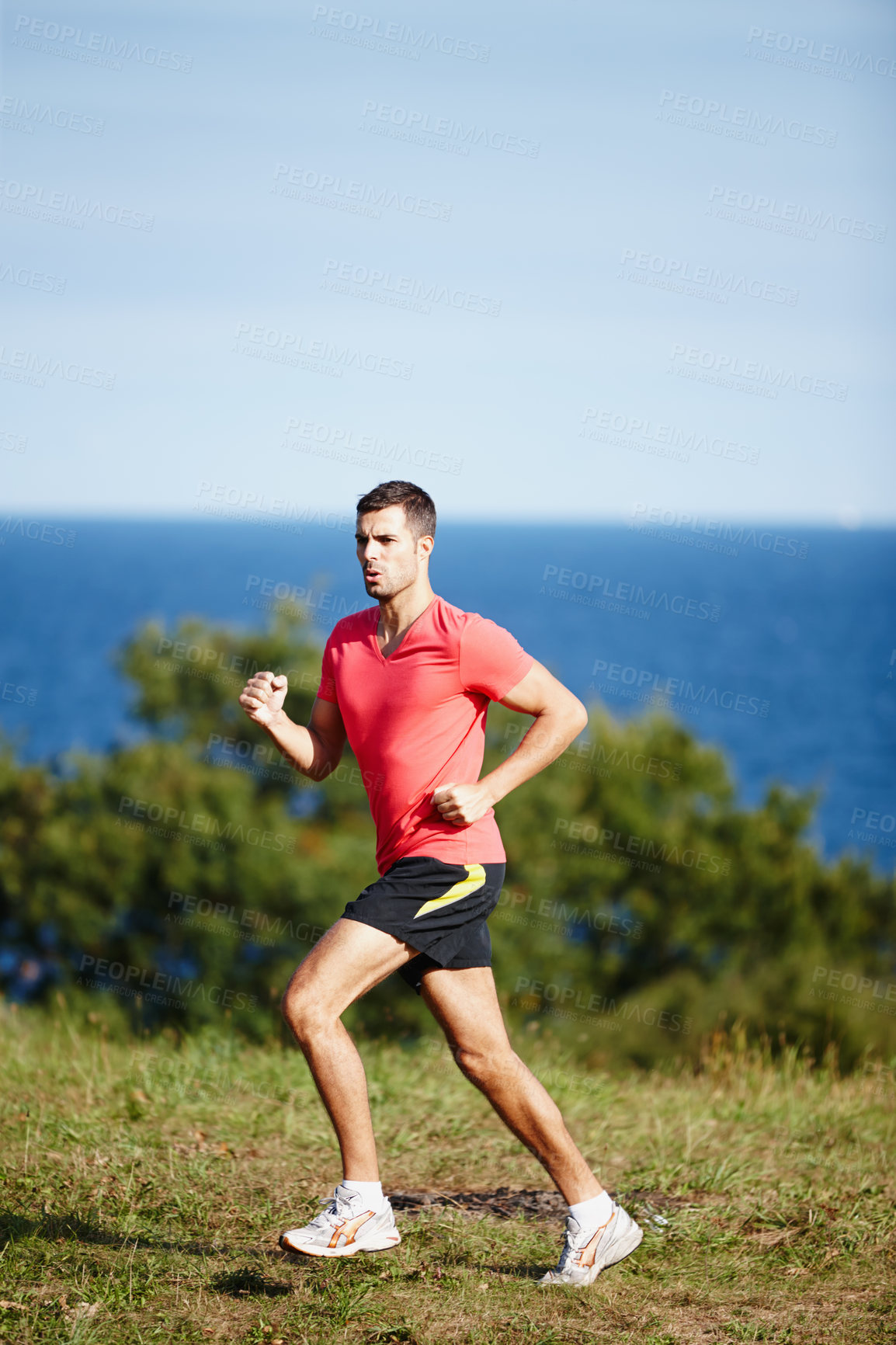 Buy stock photo Sporty, man and jogging in nature for fitness, health and wellness in outdoor for workout or exercise. Male athlete, training and cardio with endurance, muscles and strength for healthy living or gym