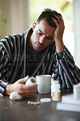 Buy stock photo Sick, man and reading vitamin medicine at home holding mug with herbal tea for recovery. Happy, male and pills for illness, disease and virus smiling for good news on positive health results 