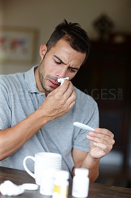 Buy stock photo Man, thermometer for temperature and sick with tissue for runny nose, sinus or hayfever with virus at home. Health fail, medication or pills with flu, monitor condition for allergies and infection