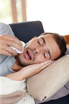 Buy stock photo Man, sick and fever with symptoms or congestion on couch for healthcare, doctor and medicine. Male person, unhealthy and illness at home for remedy, treatment and health with allergy in spring