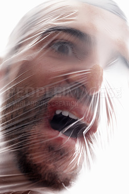 Buy stock photo Man, plastic and bag in choking, depression and mania with air in white background. Male person, expression and suffocating in crisis for awareness, help and anxiety in mental health or wellness