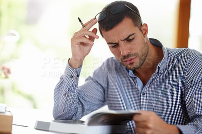 Buy stock photo Professional man, research and stress for project in startup company, burnout and anxiety for business. Notebook, reading and thinking of ideas in home for learning, career and confused.