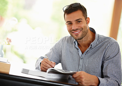 Buy stock photo Portrait, man and smile with book, studying and learning for education, university or college. Male person, student and happy with textbook, information and course for research, development and phd