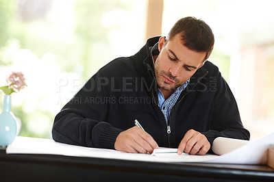 Buy stock photo Man, drawing and architect with plan for design in office, documents and writing on blueprint. Male person, drafting and engineer for building idea on paper, solution and pen for project at desk