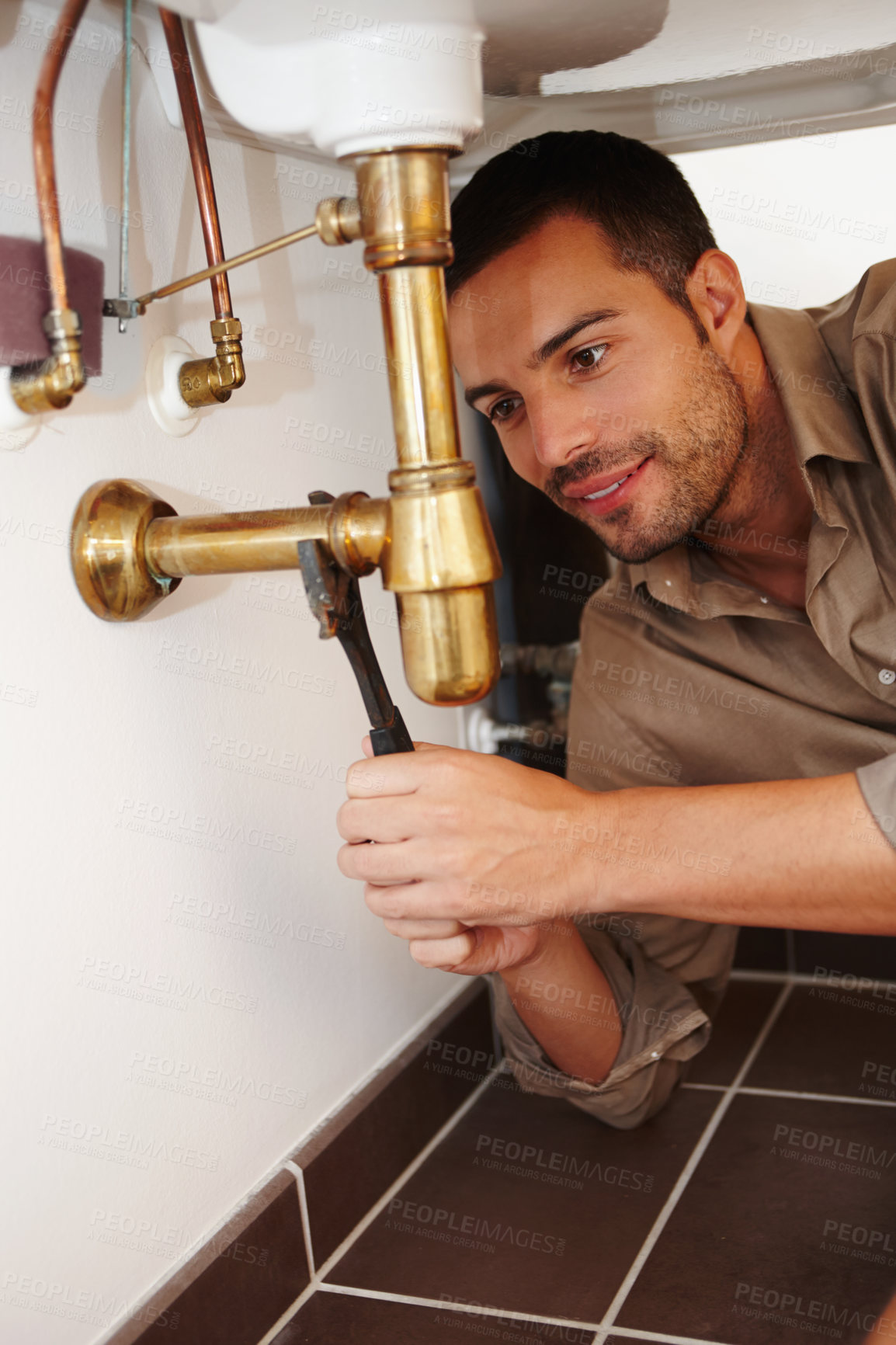 Buy stock photo Tools, handyman and male plumber for maintenance, home improvement and bathroom or house. Manual labour, spanner and sink with wrench, renovation or household construction for water pipe repair