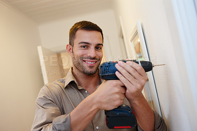 Buy stock photo Portrait, smile and drill for maintenance, handyman and home improvement for wall or house. Manual labour, tools and DIY with equipment, renovation and household construction for contractor repair