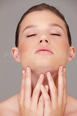 Buy stock photo Confident, woman and hands in studio for beauty, skincare and cosmetics isolated on gray background. Foundation, spa and dermatology for wellness, facial and treatment of face, aesthetic and glow.