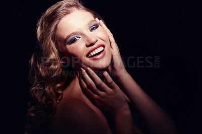 Buy stock photo A beautiful young woman posing against a black background