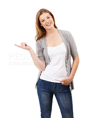 Buy stock photo Smile, pointing and portrait of woman in studio for college registration, notification or information with white background. Show, student or gen z girl for university guide, advice or decision