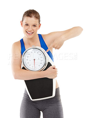 Buy stock photo Portrait of woman, pointing and scale in studio for measurement, smile and excited for results of diet. Female person, body and care for calories target or goals, weight loss and white background