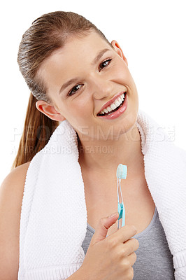 Buy stock photo A pretty teenage girl holding a toothbrush and smiling