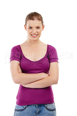 Buy stock photo Portrait of a confident teenage girl standing with her arms folded, isolated on studio background. A beautiful young blonde woman in casual clothes smiling with perfect white teeth and crossed arms