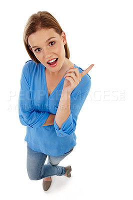 Buy stock photo Top view, pointing and portrait of woman in studio for college registration, notification or information with white background. Show, student or gen z girl for university guide, advice or decision