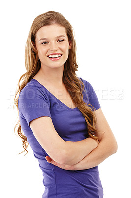 Buy stock photo Portrait of one teenager standing alone with her arms folded while isolated against white background in studio with copyspace. Smiling teenager and model posing with her arms crossed, feeling happy