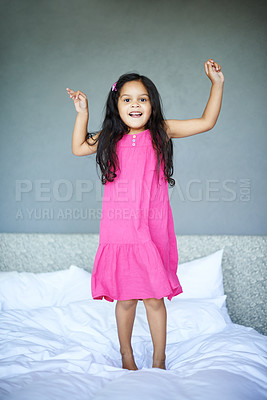 Buy stock photo Shot of an adorbale little girl jumping on the bed