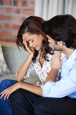 Buy stock photo Shot of a husband comforting his wife