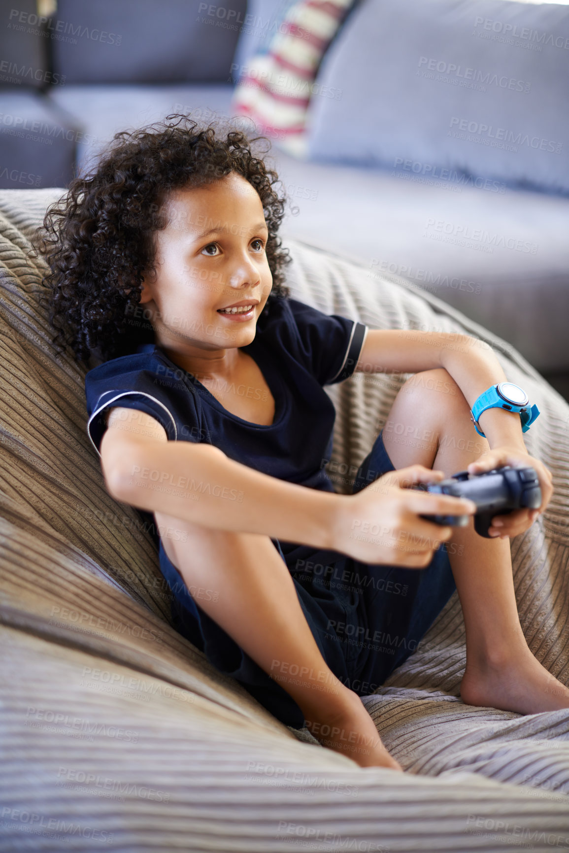 Buy stock photo Boy, child and video game on sofa in home with smile, relax and strategy for challenge in living room. Kid, gamer and controller for esports, contest and online competition on couch in family house