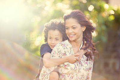 Buy stock photo Shot of a mother giving her son a piggyback ride