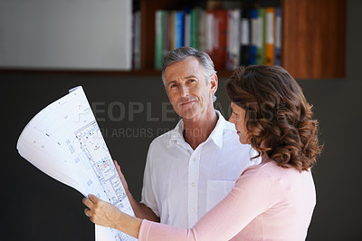 Buy stock photo Mature couple, documents and blueprint with renovation in maintenance or interior design at house. Creative man or woman with paperwork, floor plan or layout in new start, home improvement or startup