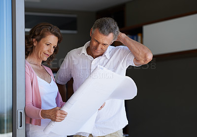 Buy stock photo Mature couple, planning and interior design with blueprint or documents for maintenance or renovation at house. Creative man or woman with paperwork or floor layout for home improvement or startup