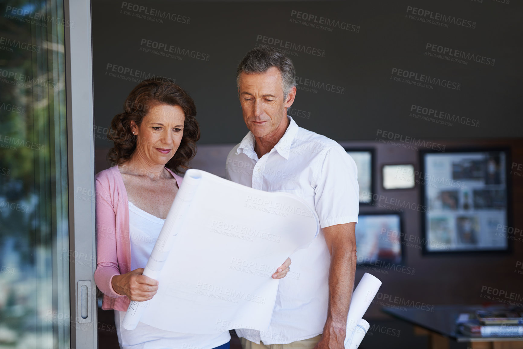 Buy stock photo Mature couple, maintenance and interior design with blueprint or documents in renovation at house. Creative man or woman with paperwork, floor plan or layout in new start, home improvement or startup