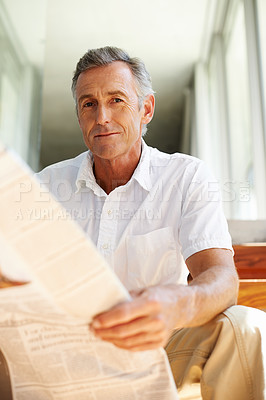 Buy stock photo Mature, man and portrait with newspaper in home for morning reading with current events, politics or international. Male person, face and relax on steps in house or journalist report or stock market