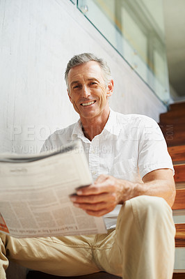 Buy stock photo Mature, man and portrait with newspaper in office for stock market review for global news, journalist or investment. Male person, face and business section on stairs for financial, report or press