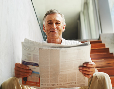 Buy stock photo Mature, man and portrait smile with newspaper for journalist report or press information, global or reading. Male person, face and home stairs for feedback review with relax, morning or apartment