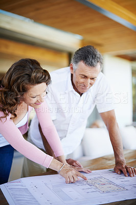 Buy stock photo Mature couple, planning and pointing with blueprint for renovation, maintenance or interior design. Creative man and woman with documents, paperwork or floor layout for startup or home improvement