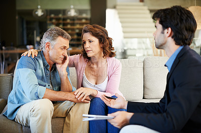 Buy stock photo A pensive mature couple receiving counselling 