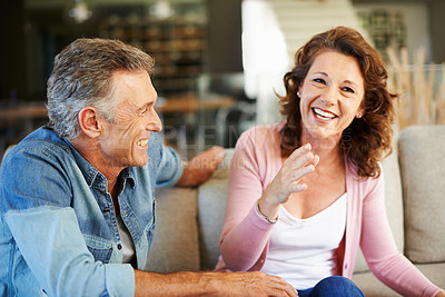 Buy stock photo Happy couple, laughing and comedy on sofa for connection, love and communication for retirement in home. Man, woman and smile in living room for marriage, memory and relax for old age or holiday