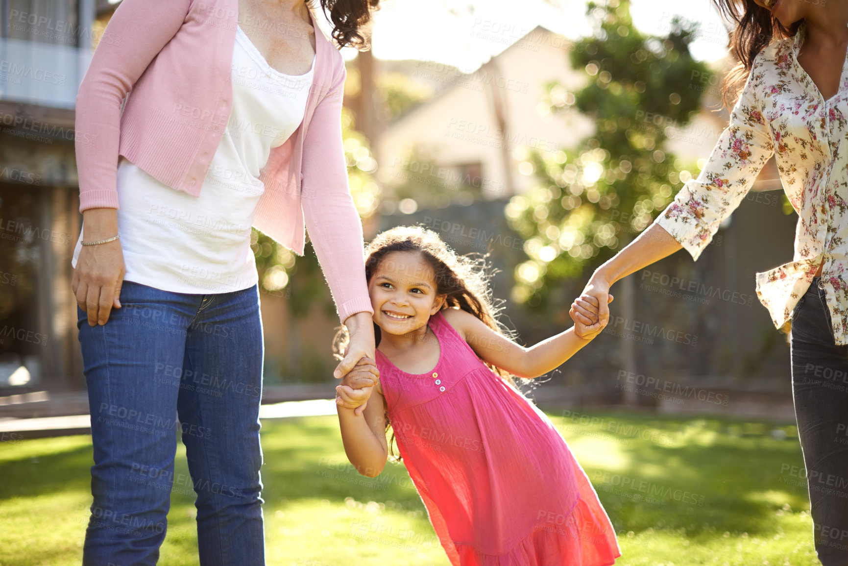 Buy stock photo Grandmother, mom or girl on grass holding hands with love, care or wellness outdoors for bonding in home. Playing, family and happy child in nature to swing with grandma, kid and smile with parent