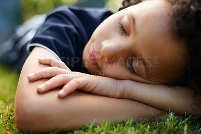 Buy stock photo Boy, kid and sleeping on grass in garden of home for resting, exhausted and tired with dreaming in nature. Child, fatigue and nap on lawn in backyard with comfort, peace or relax for wellness outdoor