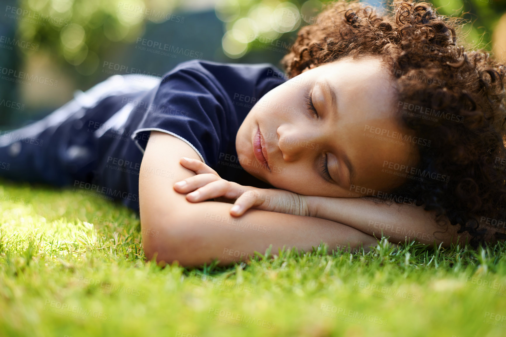 Buy stock photo Boy, child and sleeping on lawn in garden of home for resting, exhausted and tired with dreaming in nature. Kid, fatigue and nap on grass in backyard with comfort, peace or relax for wellness outdoor