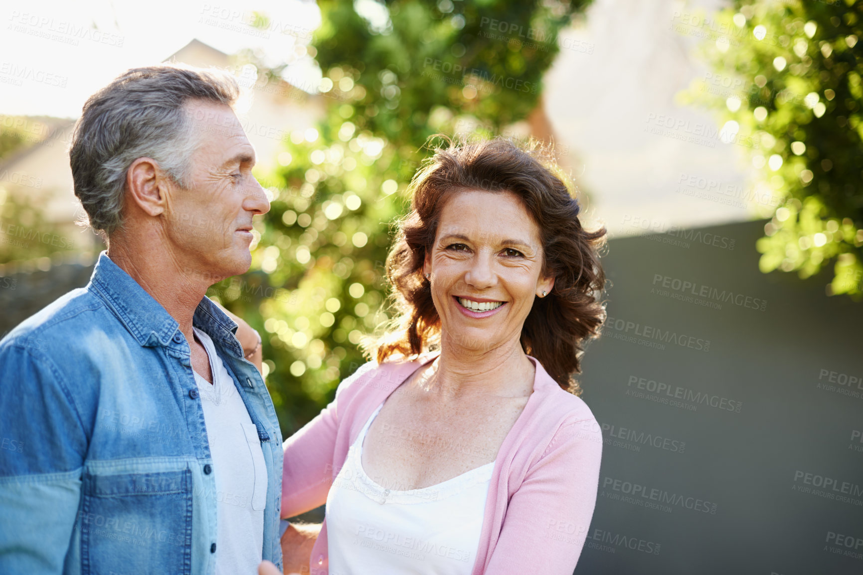 Buy stock photo Mature, couple and together for relationship in garden with smile, happiness in summer with love or bonding. Man, woman and hug in outdoor for marriage with travel, vacation with partner in Australia