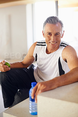 Buy stock photo Mature man, portrait and smile for workout, fitness and wellness for health and smile. Guy, apple and water for food, nutrition and hydration with diet happiness and training for cardio exercise