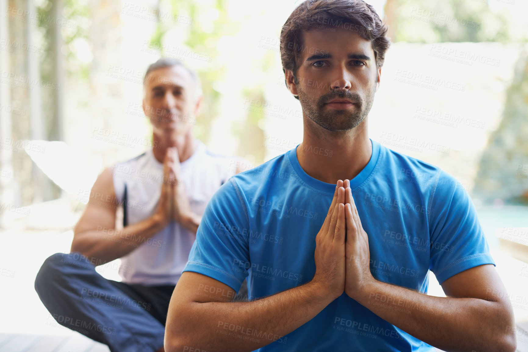 Buy stock photo Cropped view of a two men doing yoga 