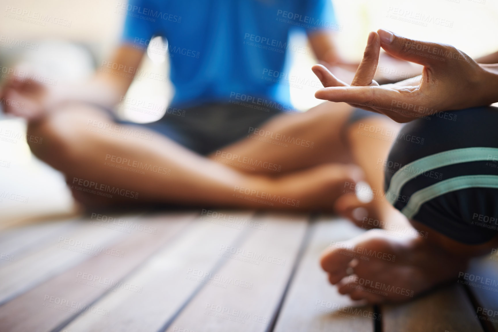 Buy stock photo Cropped view of a two people doing yoga in the lotus position
