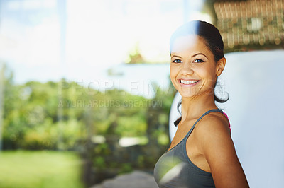 Buy stock photo An attractive young woman smiling while indoors