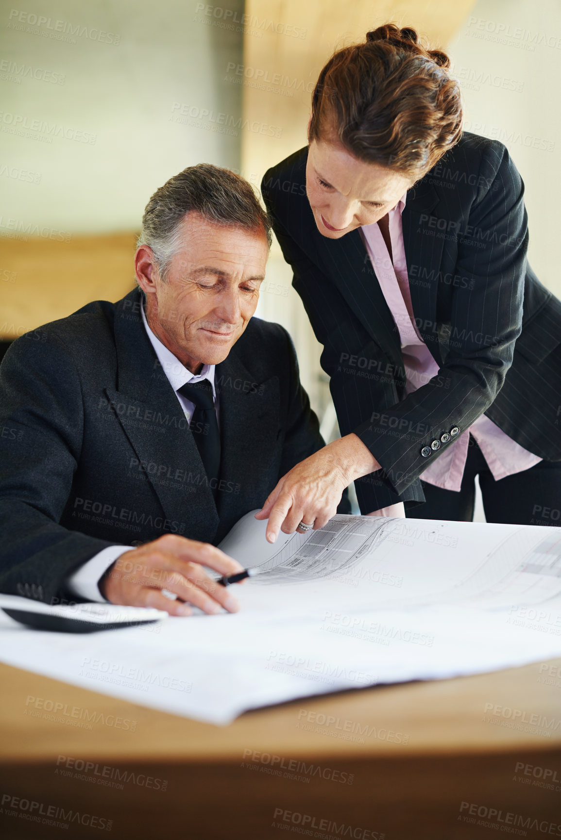 Buy stock photo Businessman, architect and plans with office, discussion and collaboration for engineering project. Woman, mentor and architecture with teamwork, blueprints and review for construction design