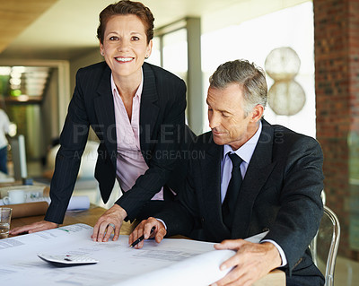 Buy stock photo Man, architect and plans with office, discussion and collaboration for engineering project. Mature woman, businessman and architecture with teamwork, blueprints and review for construction design