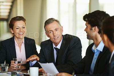 Buy stock photo A group of businesspeople having a meeting