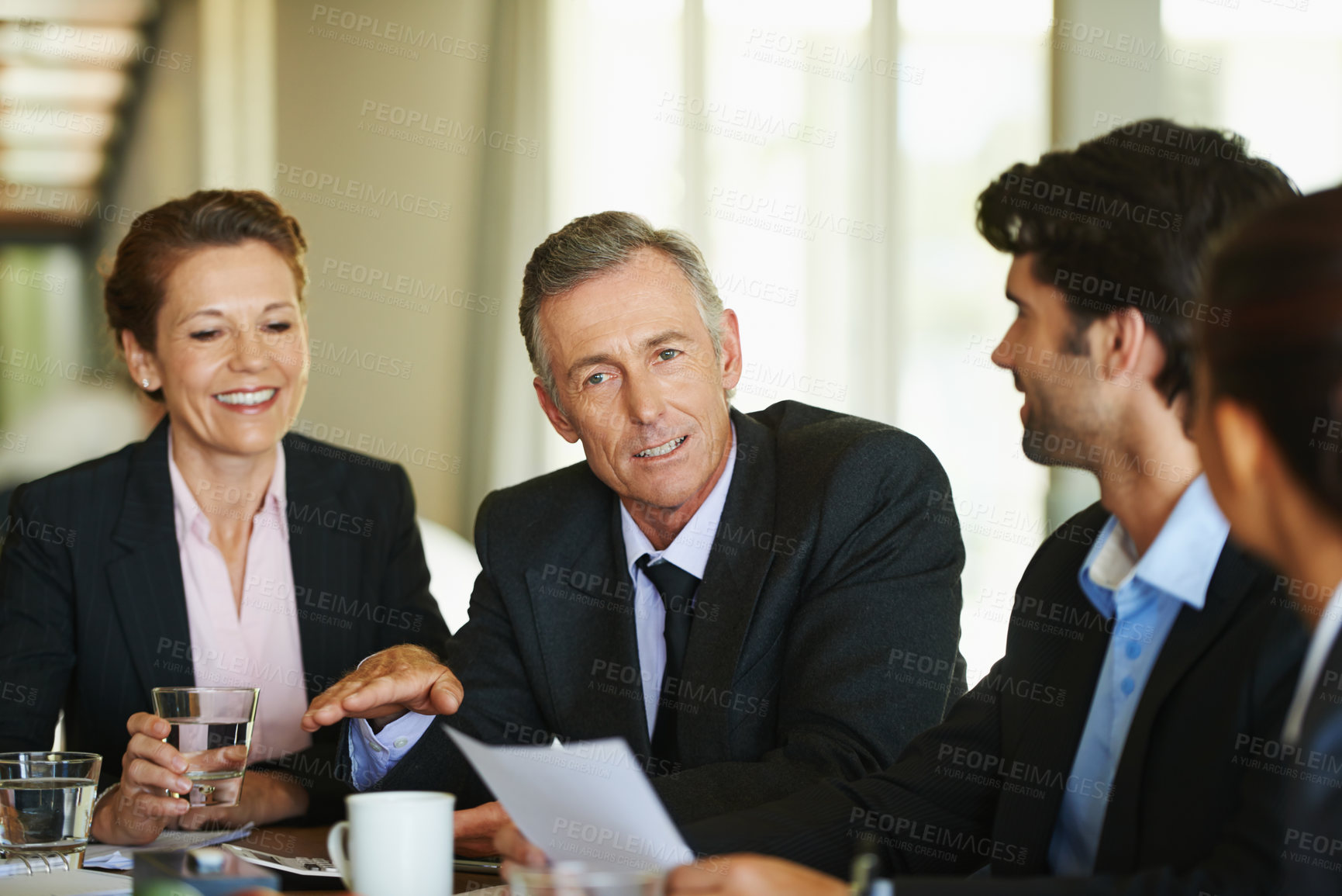 Buy stock photo A group of businesspeople having a meeting