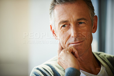 Buy stock photo Closeup shot of a handsome mature man with his hand on his chin