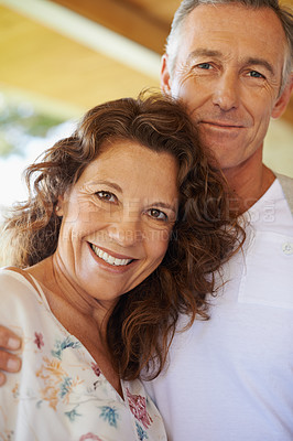 Buy stock photo An attractive and loving mature couple standing together 