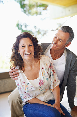 Buy stock photo Portrait, happy and couple together for love, connection or trust at home patio for partnership. Laughing, woman and embrace mature man with care, commitment and healthy relationship for support