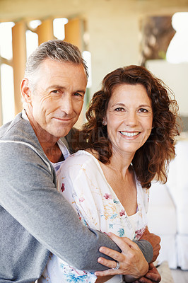 Buy stock photo Portrait, mature and happy couple hug in home for love, connection or trust for partnership together. Face, man and embrace woman for care, commitment and healthy relationship for support in house