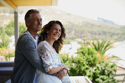 Buy stock photo Home, balcony or mature couple hug on anniversary for support, date or love for care, marriage or trust. Smile, view or happy woman bonding with man in retirement, honeymoon break or house to relax