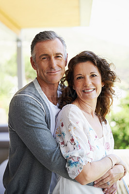 Buy stock photo Portrait, smile and mature couple hug in house patio for love, connection or trust for partnership together. Face, man and embrace woman for care, commitment and relationship for support in home