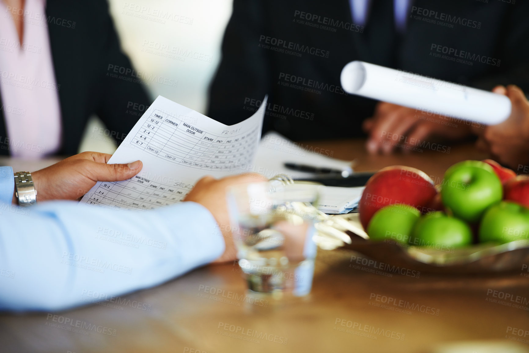 Buy stock photo Meeting, desk and document in hands of business people with schedule for office hours and collaboration for report. Paper, corporate staff and cooperation with proposal review and project feedback